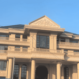 乐山黄金麻别墅外墙干挂石材效果示例